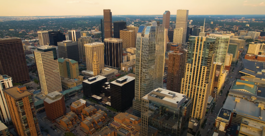 Bird's eye view of a city with tall buildings, captured from above